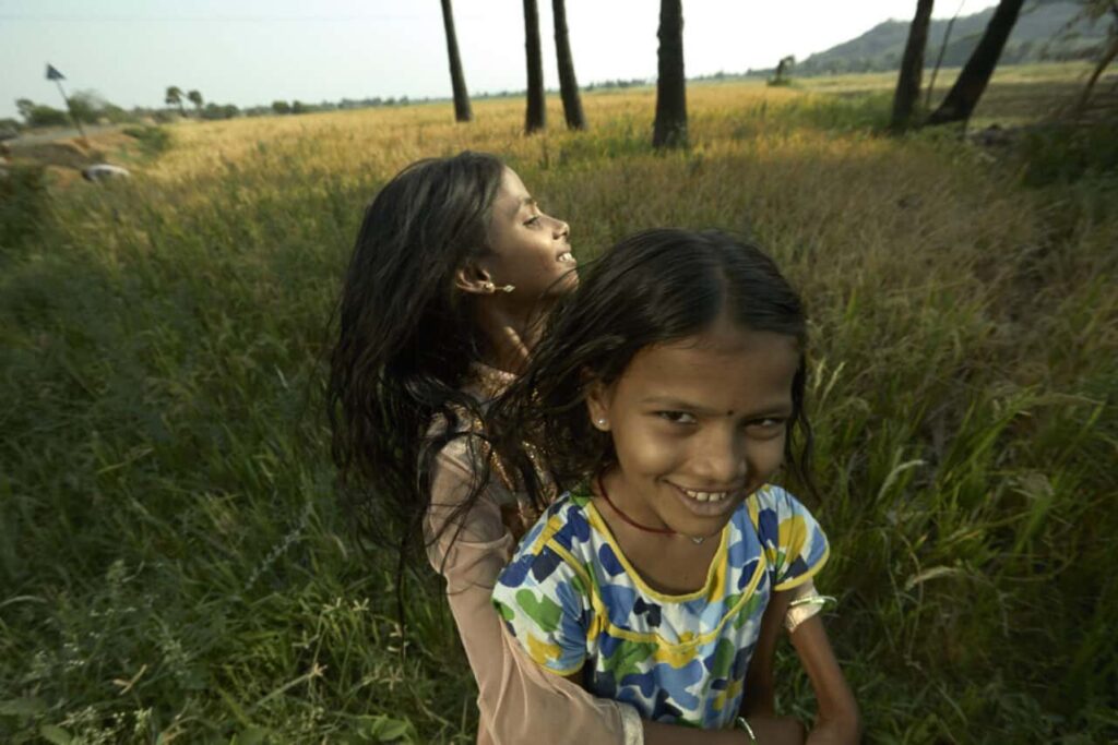 Girls playing in field