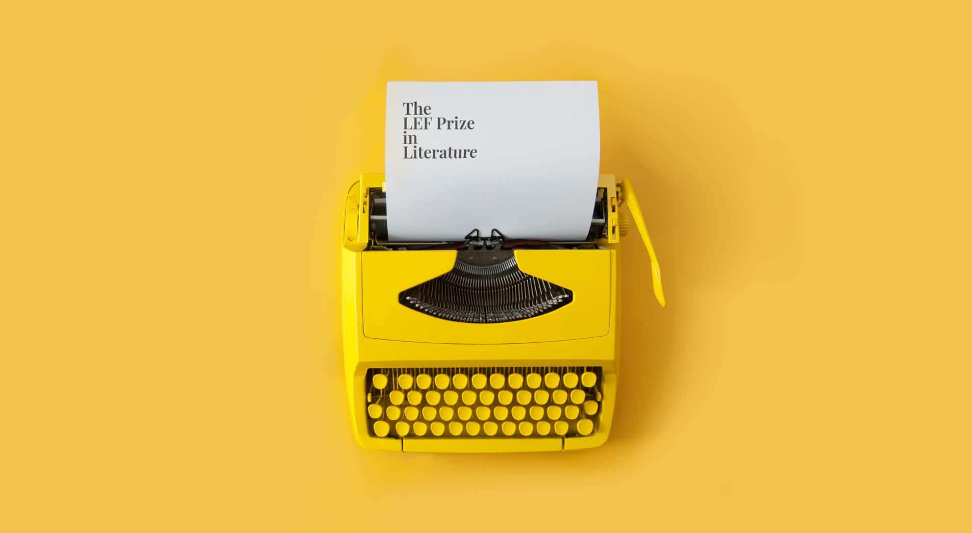 Yellow retro typewriter used as key image for impact idea LEF Prize in Literature